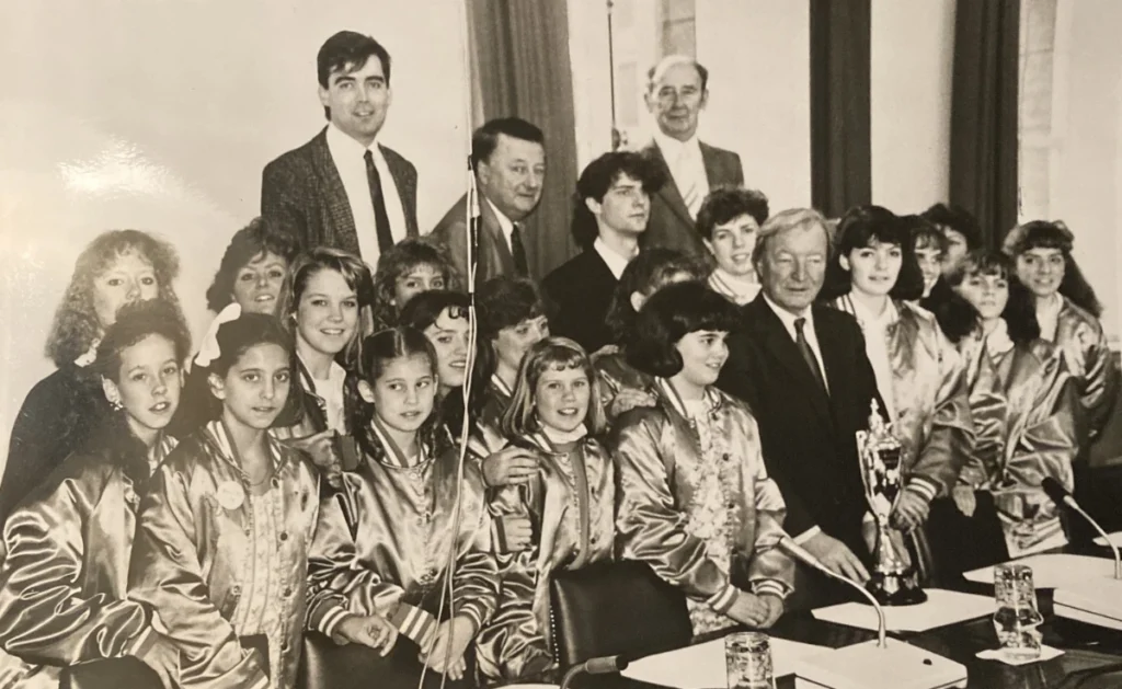 1987 - Trinity dancers and Founder Mark Howard with Charles Haughey, the Prime Minister of Ireland after winning America's first world championship team gold medal.